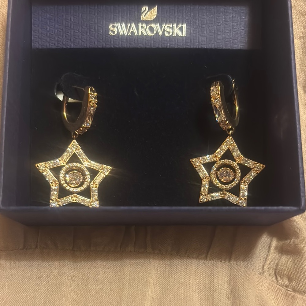 Swarovski Gold Star Dangle Earrings. authentic